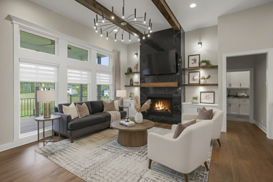 A living room photographed by The Perfect Spot For You, with a fire in the fireplace